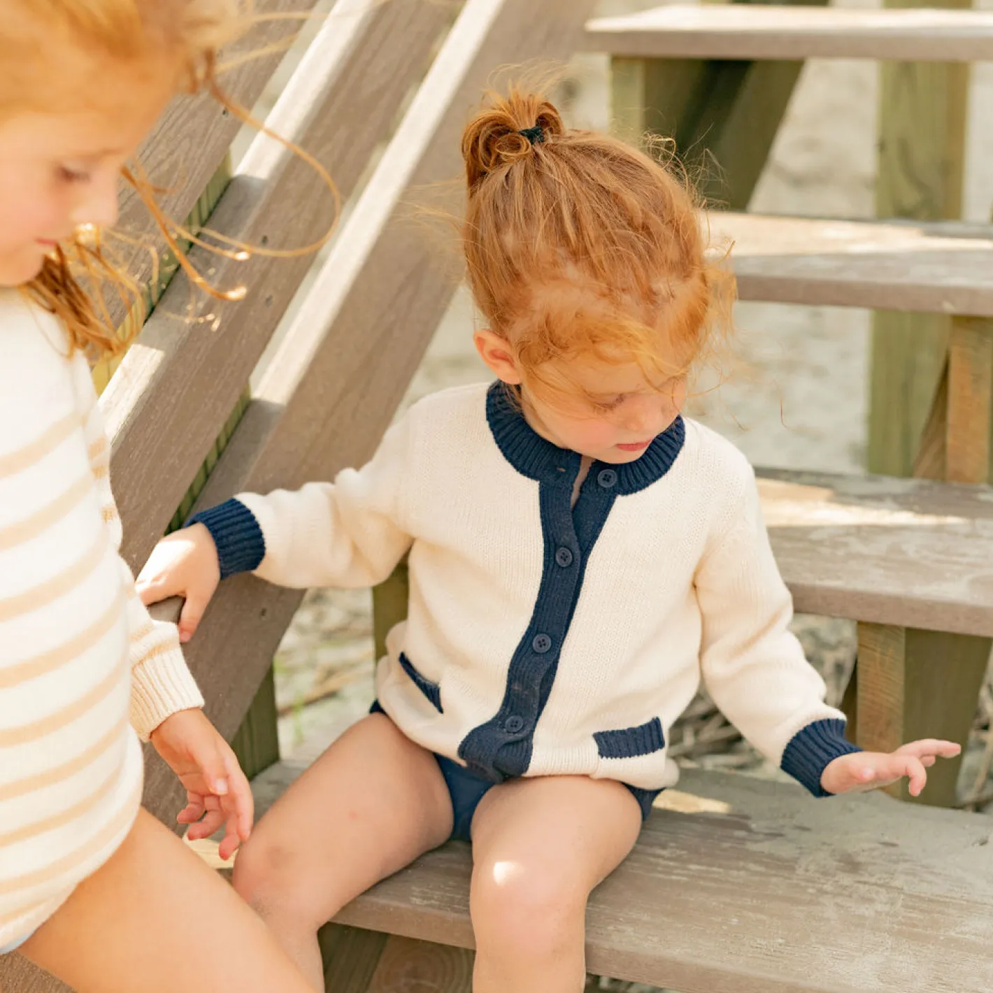 unisex cream and navy trim knit cardigan